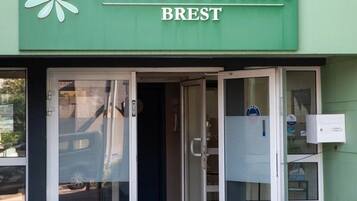 A storefront with a green awning and a sign that reads 'Terres de France BREST.'