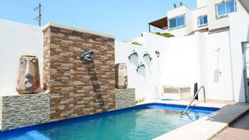 Outdoor pool, pool umbrellas, sun loungers