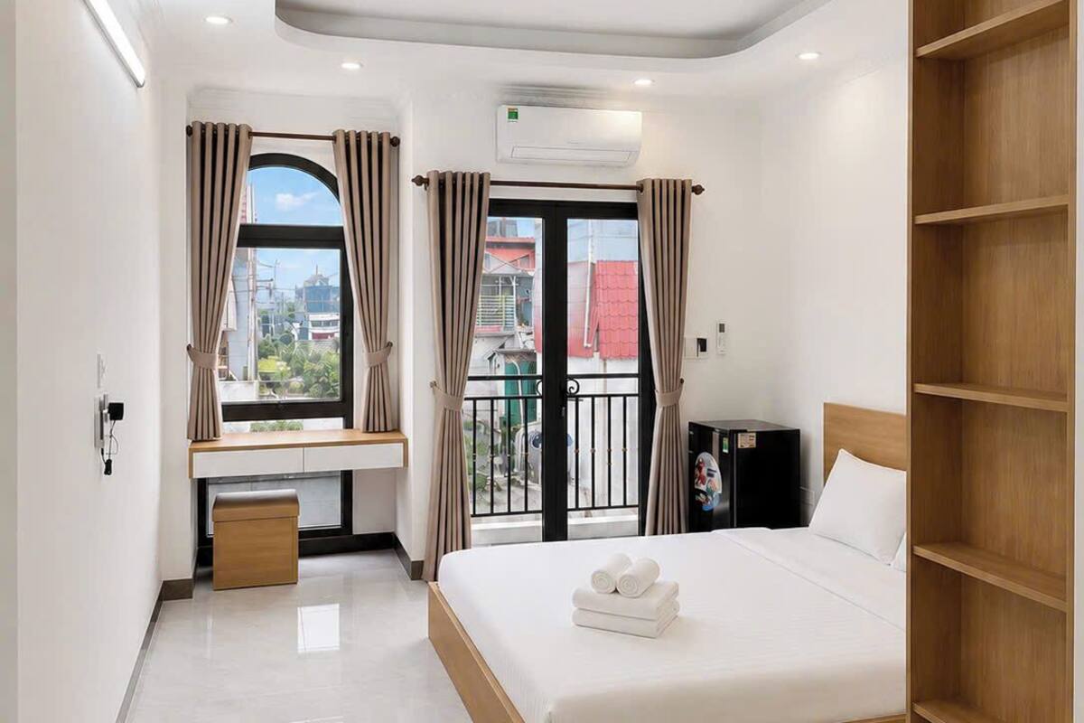 Deluxe Suite, Balcony, City View | Desk, laptop workspace, free WiFi