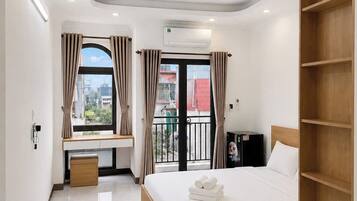 Deluxe Suite, Balcony, City View | Premium bedding, memory-foam beds, individually decorated