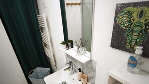 A bathroom with a white sink, mirror, and a towel rack. - House les acacias - 6 people (Mauléon)