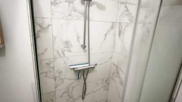 Shower, hair dryer, towels, soap