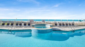 A swimming pool with lounge chairs and a hot tub. - Beachfront 2BR @ Admiral Quarters • Sleeps 8 • Stunning Views (Orange Beach)