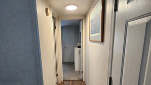 A narrow hallway with wooden flooring, white walls, and a door on the right. - Serene two bedroom mobile home with AC in Murphy, ID.
Outdoor recreation galore! (Murphy)