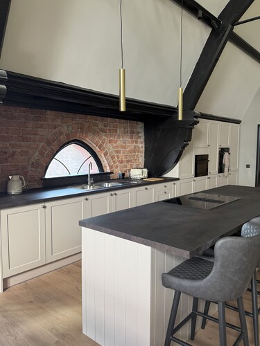 Stay in a converted church, 5 king-size ensuite bedrooms, openplan living space.