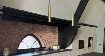 Stay in a converted church, 5 king-size ensuite bedrooms, openplan living space.