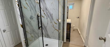 Shower, towels, soap, toilet paper