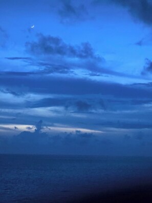 A night sky with clouds and a crescent moon. - Spacious 4-bedroom house with AC in amazing Brevard CONNESTEE FALLS (Brevard)