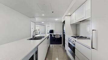 Deluxe Apartment, River View | Private kitchen | Highchair