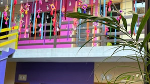 A multi-story building with balconies decorated with colorful hanging ornaments. - Amaizing Place in Sayulita (Sayulita)
