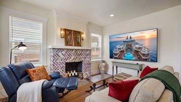 Smart TV, fireplace, books, offices
