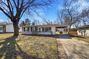 A single-story mobile home with a front porch, a garage, and a fenced yard. - Beautiful 3-bedroom house (Dayton)