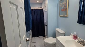 Shower, hair dryer, towels, soap