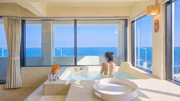 Luxury Suite, Ocean View | Laptop workspace, blackout drapes, free WiFi