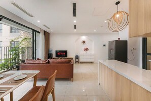 Business Apartment, 2 Bedrooms, City View, Tower | Living room | 60-inch Smart TV with digital channels, pay films -  Vinhomes D'Capitale Luxury Apartment - Brian Homes (Cau Giay)