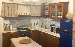 A kitchen with a stove, sink, and cabinets. - Gorgeous home in Villa Collemandina (Villa Collemandina)
