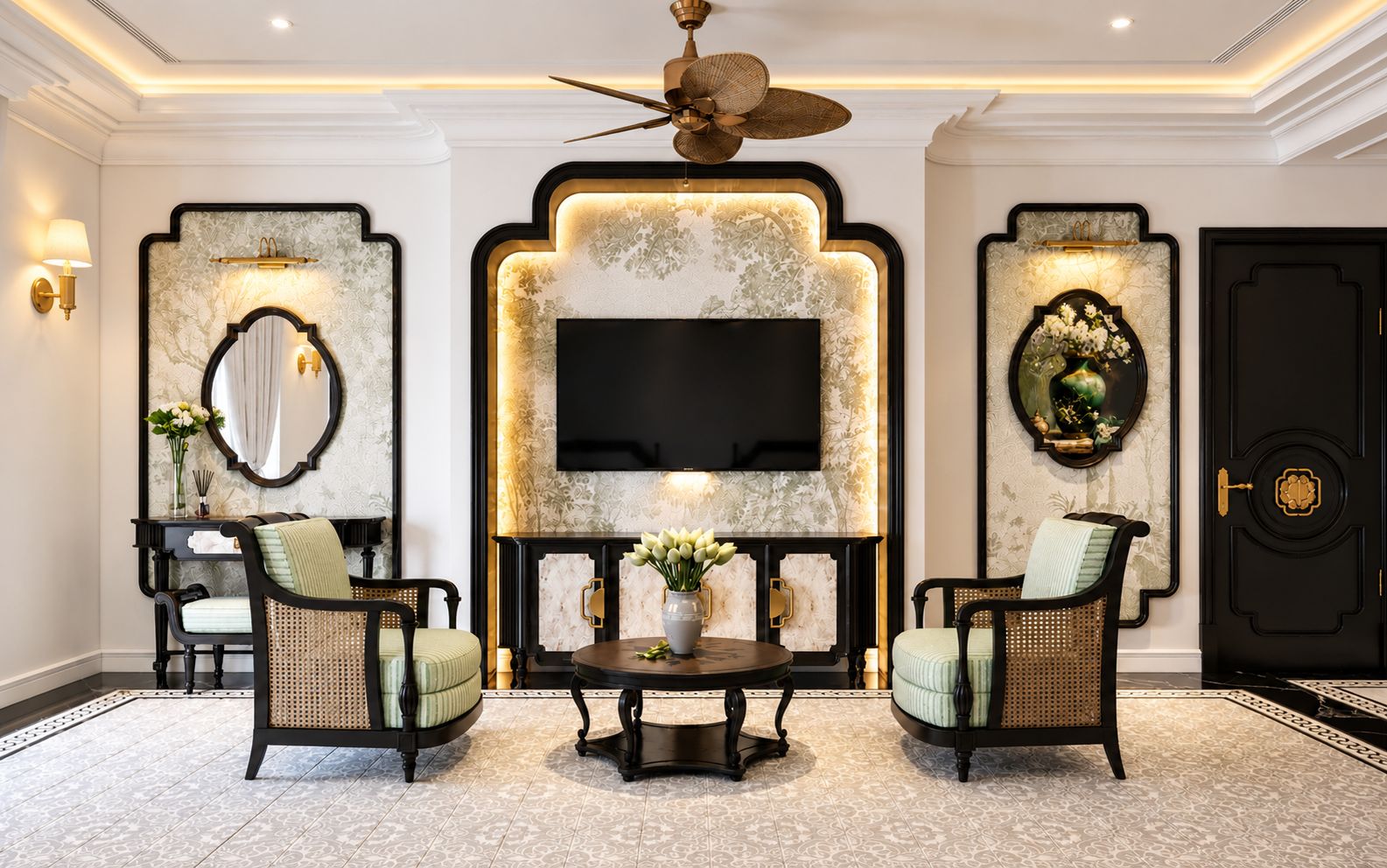 A spacious living room with a large flat-screen TV, two armchairs, a coffee table, and a decorative wall with a fireplace.