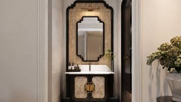 A hallway with a mirror, a sink, and a patterned floor.