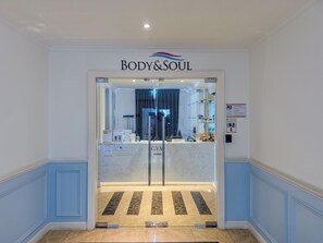 A reception area with a marble floor, a reception desk, and a sign above reading 'BODY& SOUL'. - Seven Seas Cote D'Azur Nice by GV (Tambon Na Chom Thian)