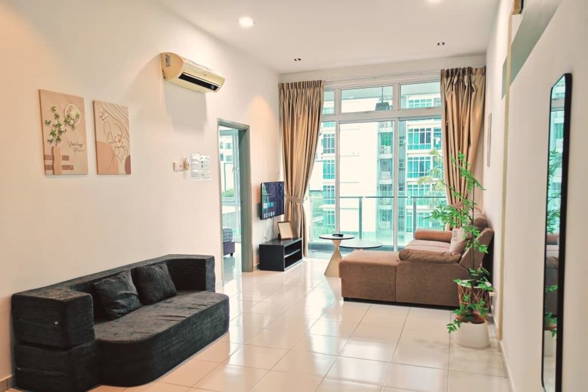 A modern living room with a sofa, a coffee table, and a potted plant.