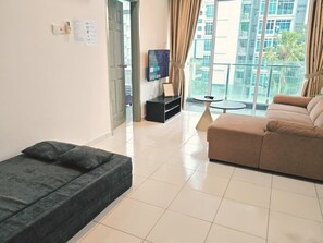 Departamento junior, vista al jardín | Área de sala de estar
