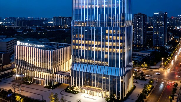 A modern hotel with a glass facade, multiple floors, and a prominent signage. - PALACE Hotel（Hangzhou Huayin Tower Hangzhou City University） (Hangzhou)