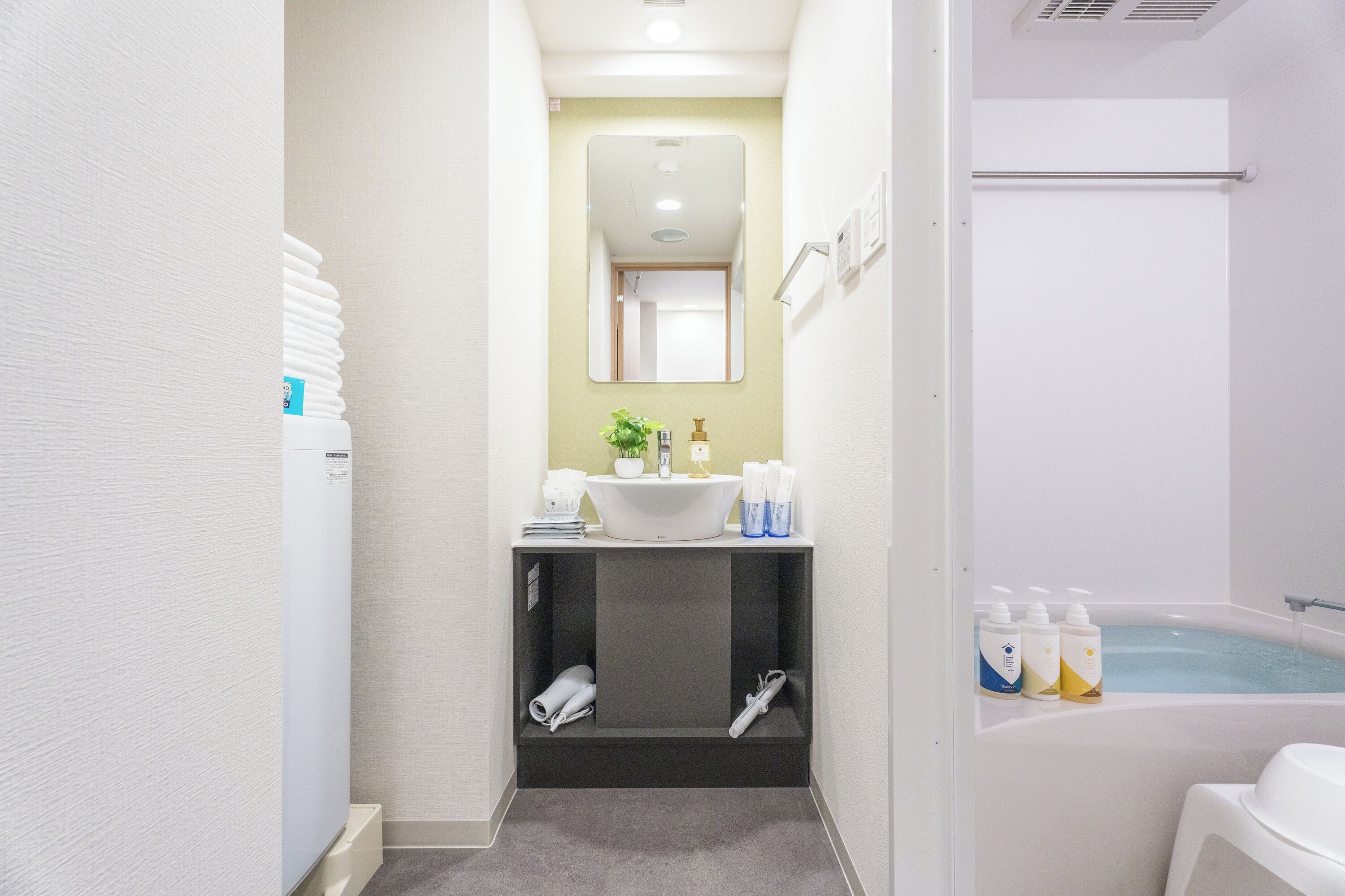 Deluxe Twin Room, City View | Bathroom | Hair dryer, slippers, towels, soap