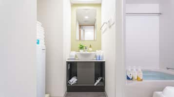 Deluxe Twin Room, City View | Bathroom | Hair dryer, slippers, towels, soap