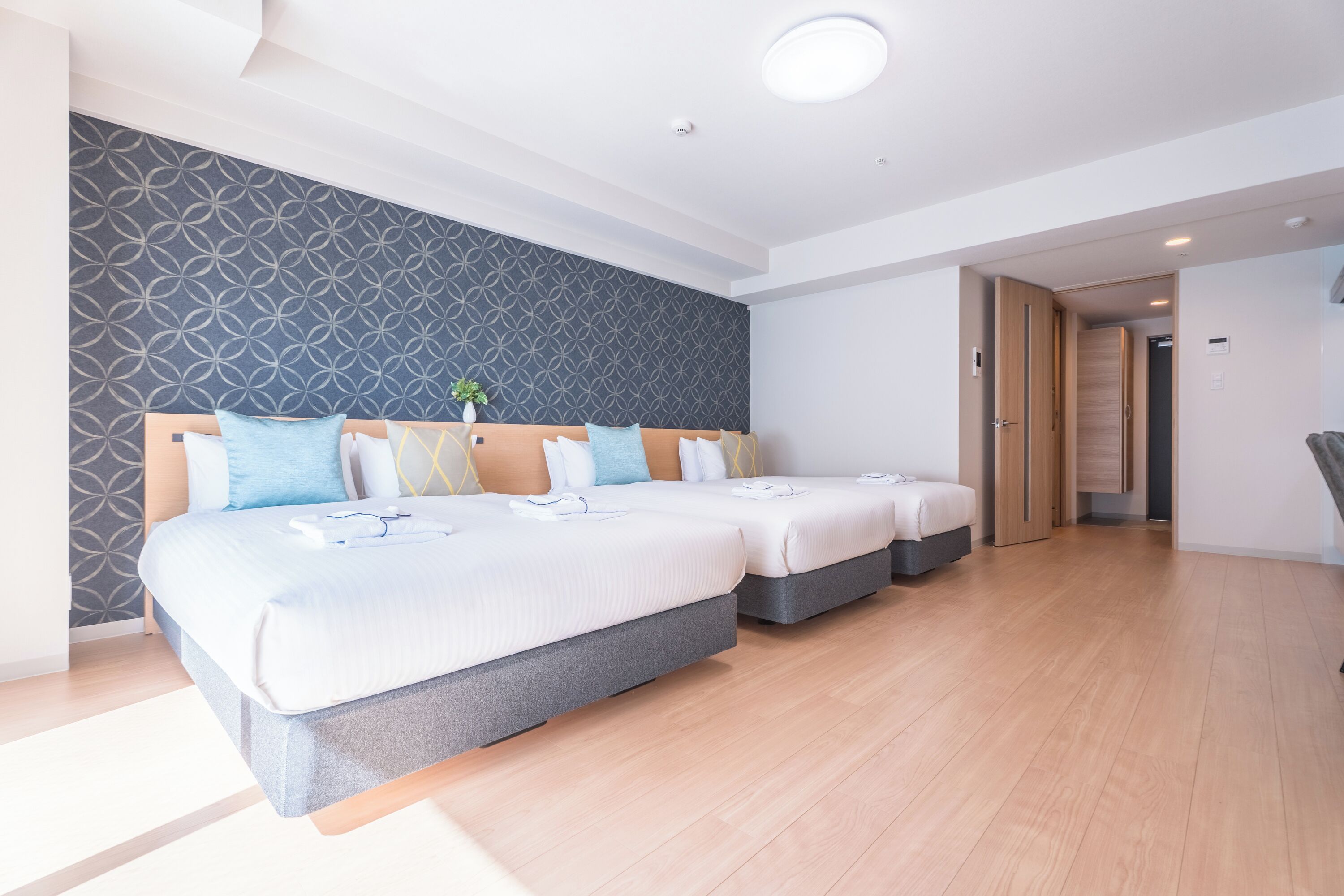 Deluxe Triple Room | Desk, blackout drapes, iron/ironing board, free WiFi