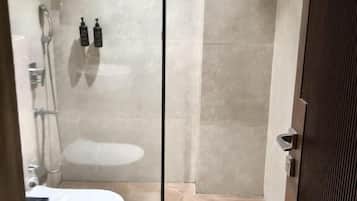 Shower, hair dryer, slippers, towels
