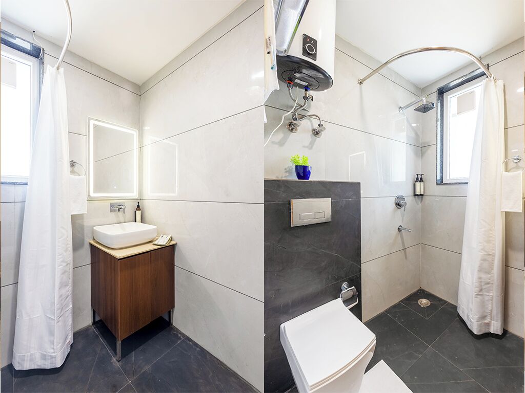 Habitación doble Deluxe, baño privado, vista a la ciudad | Baño | Regadera, amenidades de baño gratuitas, secadora de cabello, pantuflas 