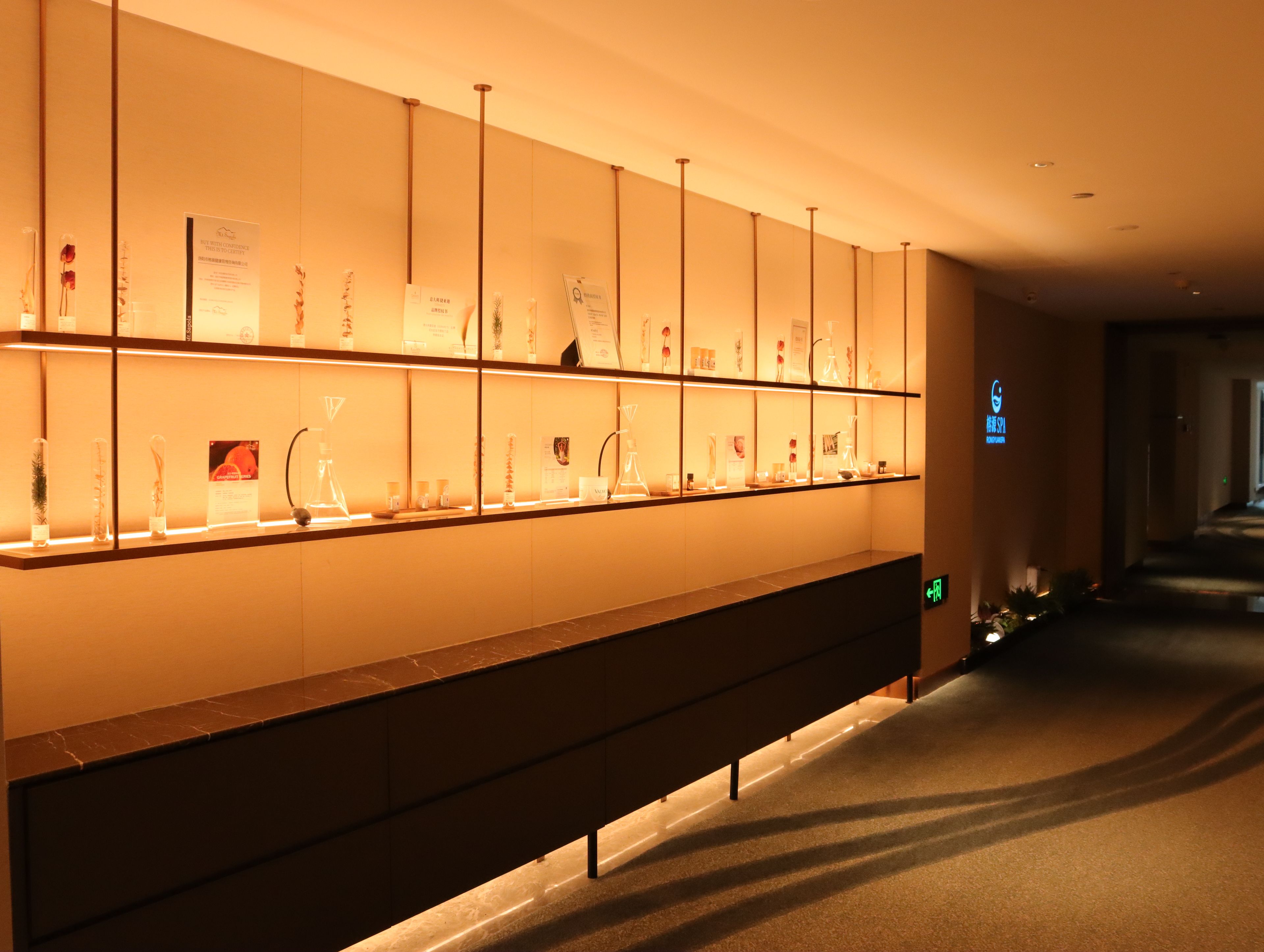 A hotel reception area with a long counter displaying various items.