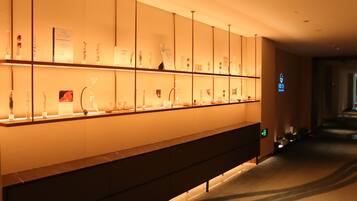 A hotel reception area with a long counter displaying various items.