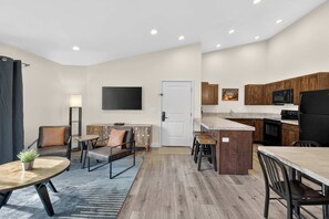 A modern apartment with a kitchen, dining area, and living room. - 4-L Stargazing Redcliff Condo (Top Floor) (Moab)
