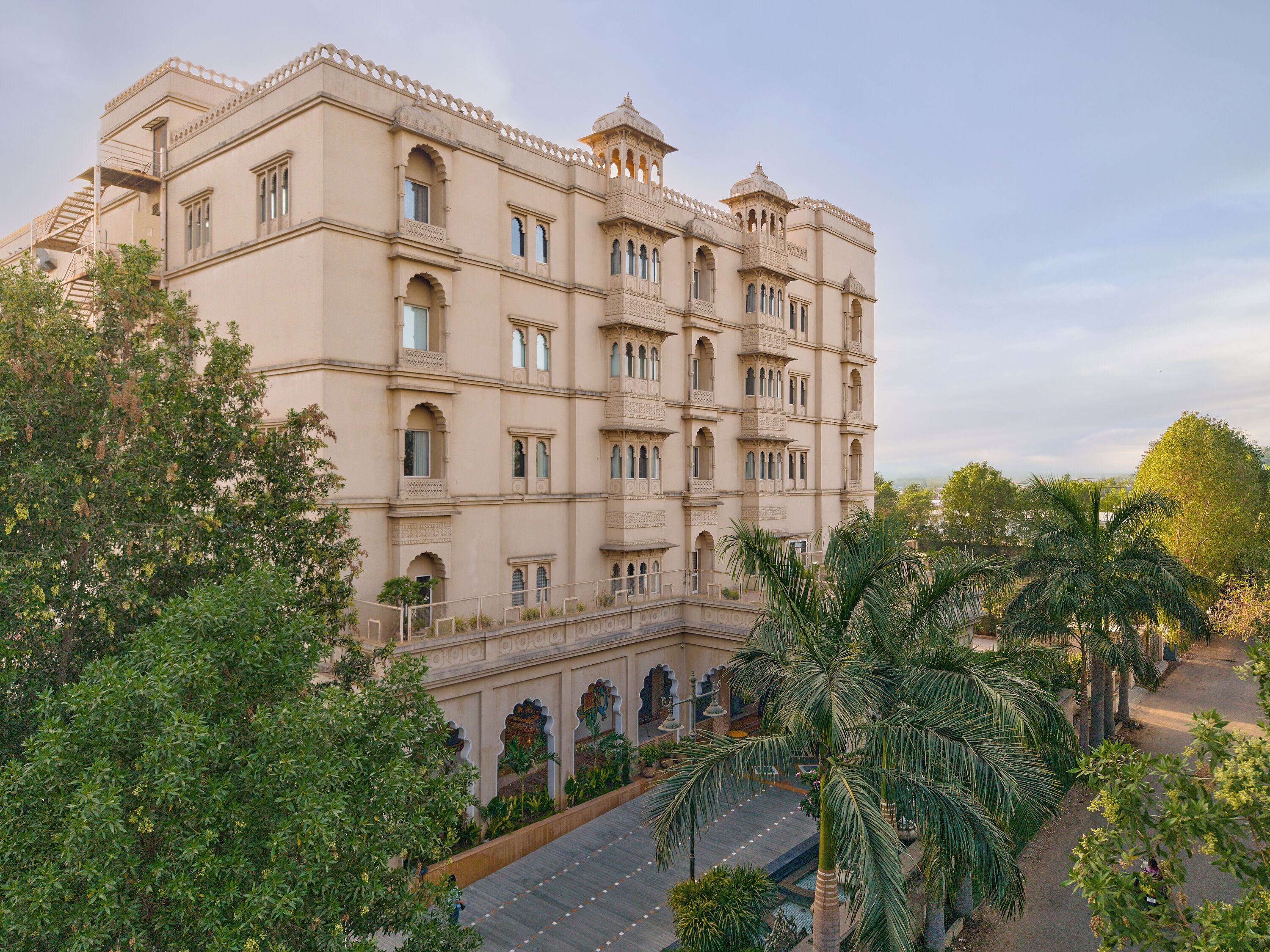 A multi-story building with a traditional architectural style, featuring arched windows and balconies.