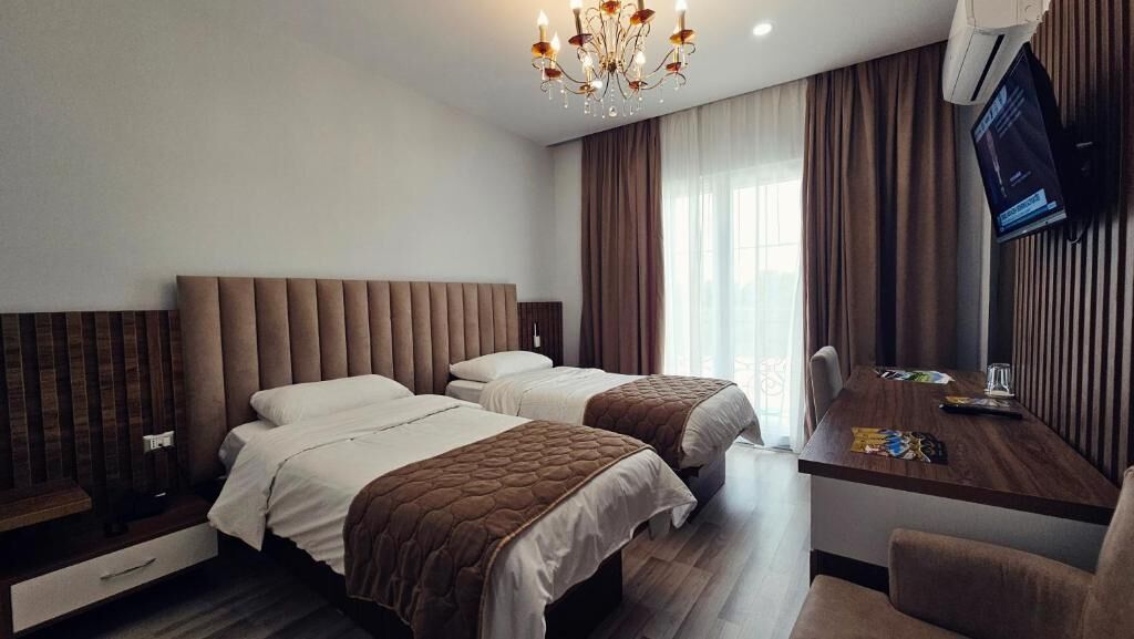 Twin Room, Balcony, Pool View | In-room safe, iron/ironing board, free WiFi