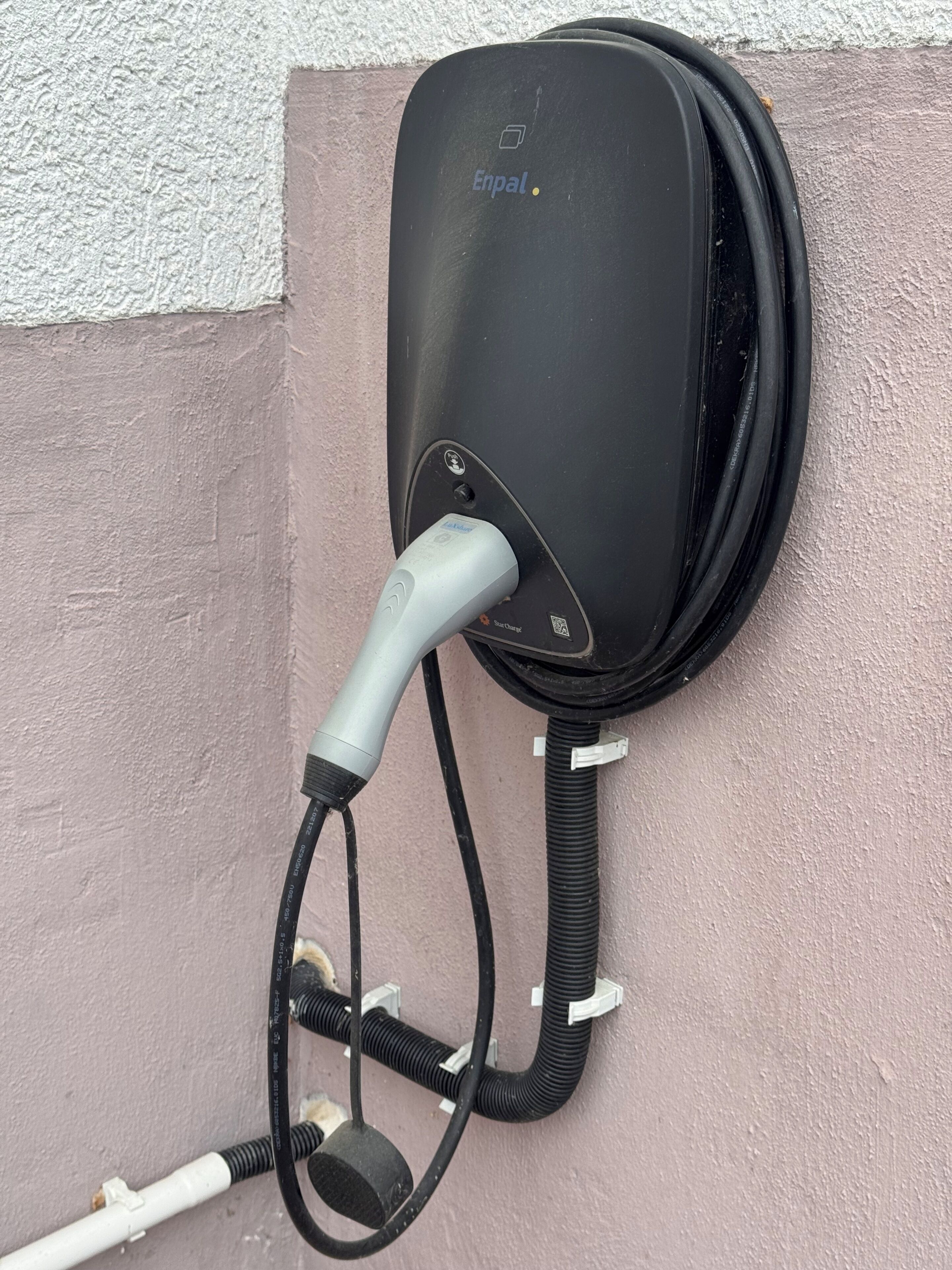 An Enpal electric vehicle charging station mounted on a wall.
