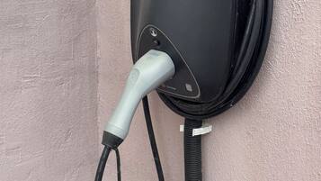 An Enpal electric vehicle charging station mounted on a wall.