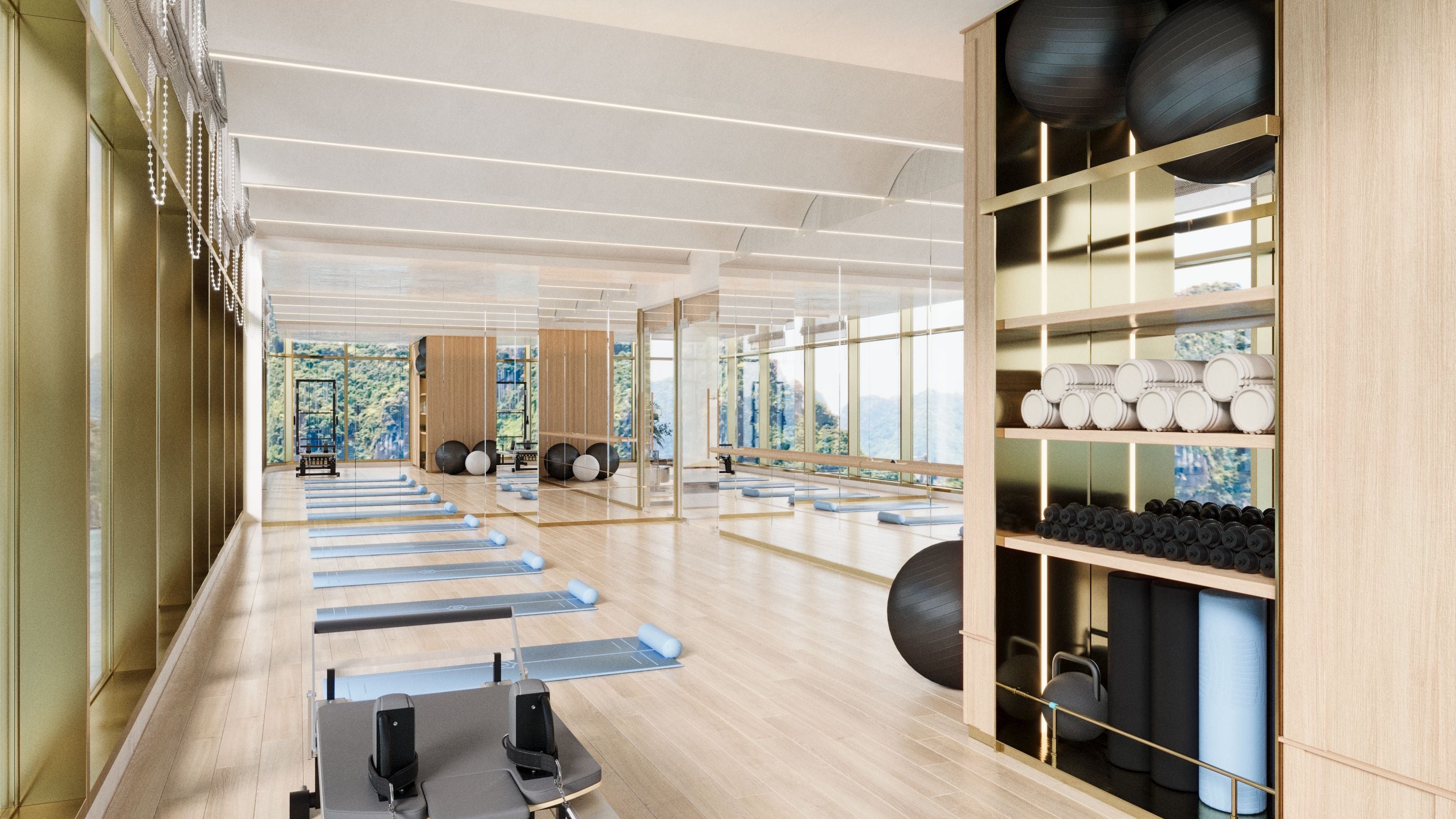 Un gimnasio moderno con colchonetas de ejercicio, esterillas de yoga y pelotas de entrenamiento.