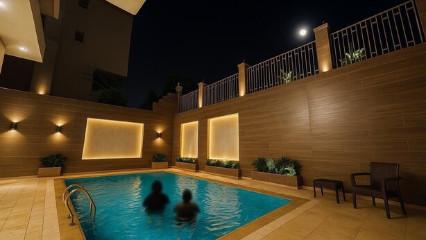 A swimming pool with two people, surrounded by wooden walls and modern lighting fixtures. - Modern 2-Bedroom Apartment with Private Building Pool - ST4 (Giza)