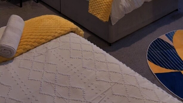 A bedroom with a bed, bedside table, and a window with curtains. - Cozy 2-Bedroom Apartment in Tyne and Wear (Tyne and Wear)