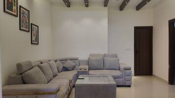 Luxury Suite With Balcony and Seating Lounge | Living area | LED TV