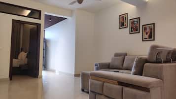 Luxury Suite With Balcony and Seating Lounge | Living area | LED TV