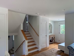 A staircase with wooden steps and a white door at the top. - Peaceful and Private 4-Bedroom Home in Southampton (Southampton)