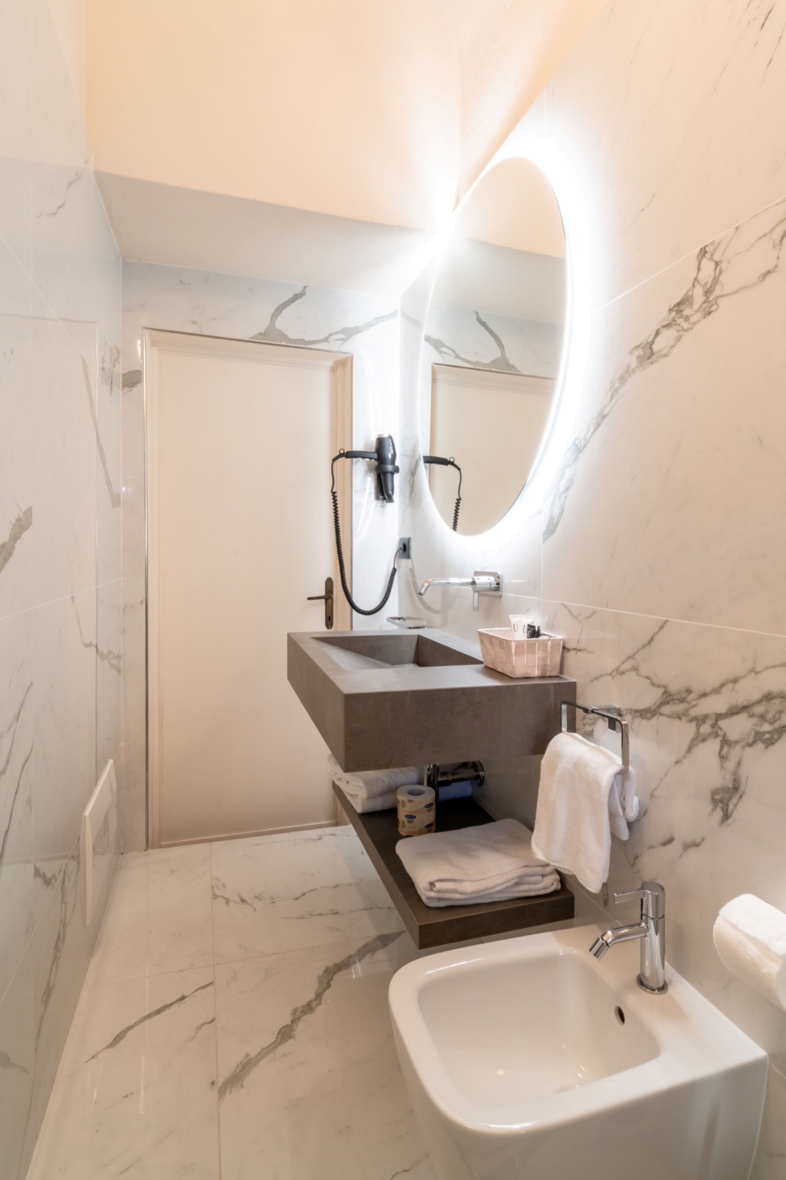 Shower, hair dryer, towels, toilet paper