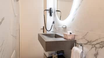 Shower, hair dryer, towels, toilet paper