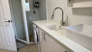 Shower, hair dryer, towels, soap
