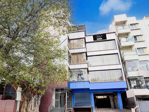 A multi-story building with a sign reading 'Collection.' - Super Collection O Banaswadi (Bengaluru)