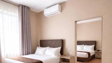 Family Room, City View | In-room safe, blackout drapes, iron/ironing board, free WiFi