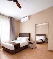 Family Room, City View | In-room safe, blackout drapes, iron/ironing board, free WiFi